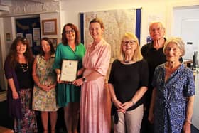 High Sheriff of Leicestershire, Henrietta Chubb, presents a special award to CEO Amanda Heath and her MADMAC team