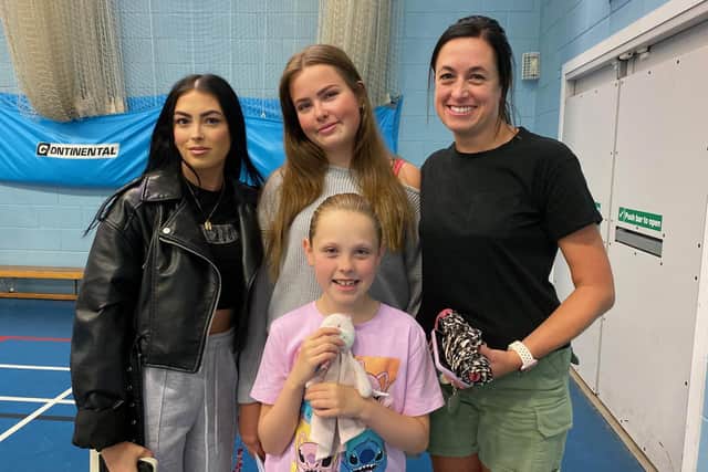 Scarlet Kerr (back, centre) celebrates her GCSE results at Long Field with her family