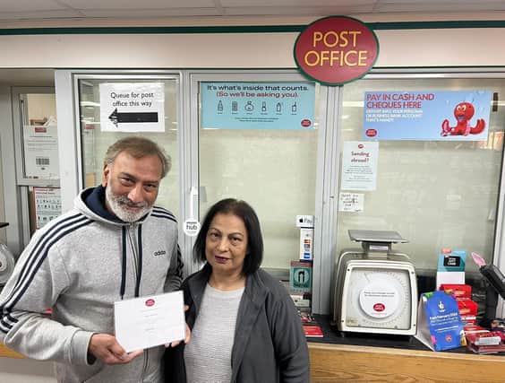 Raj and Yadvinder Bains, with their long service award after running the Post Office at Welby Lane for 30 years