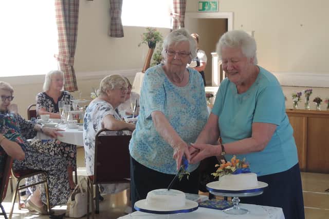 Jean Egglestone and Daphne Bullimore cut the cake to celebrate the 65th anniversary of the founding of Melton Mowbray and District Flower Club