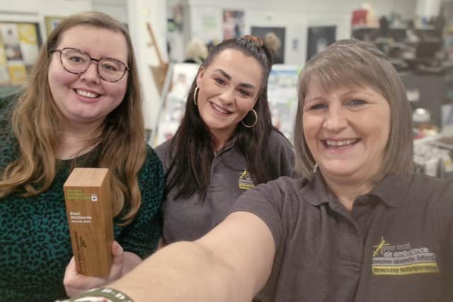 Manager Kerry Martin (right) with colleague at Melton's The Hanger with the trophy after it was named UK's favourite charity shop