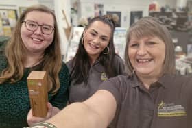 Manager Kerry Martin (right) with colleague at Melton's The Hanger with the trophy after it was named UK's favourite charity shop