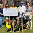 Members of the Quorn Hunt present a fundraising cheque to representatives of the Derbyshire, Leicestershire and Rutland Air Ambulance