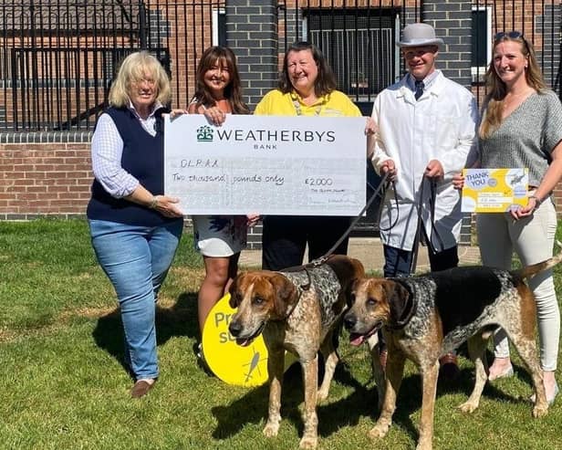 Members of the Quorn Hunt present a fundraising cheque to representatives of the Derbyshire, Leicestershire and Rutland Air Ambulance