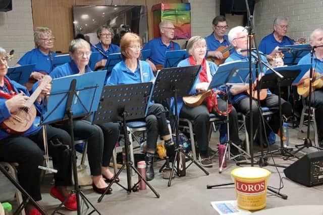 Melstrum Ukulele Orchestra strum and sing for LOROS at Hamilton Tennis Club