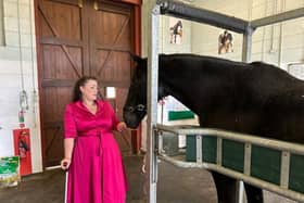 Melton MP Alicia Kearns with a military horse at the DATR base