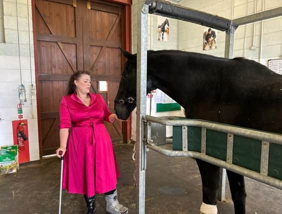 Melton MP Alicia Kearns with a military horse at the DATR base