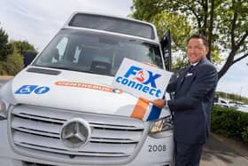 Councillor Andrew Hamilton-Gray with a FoxConnect bus used by Leicestershire County Council to plug gaps in the bus service network