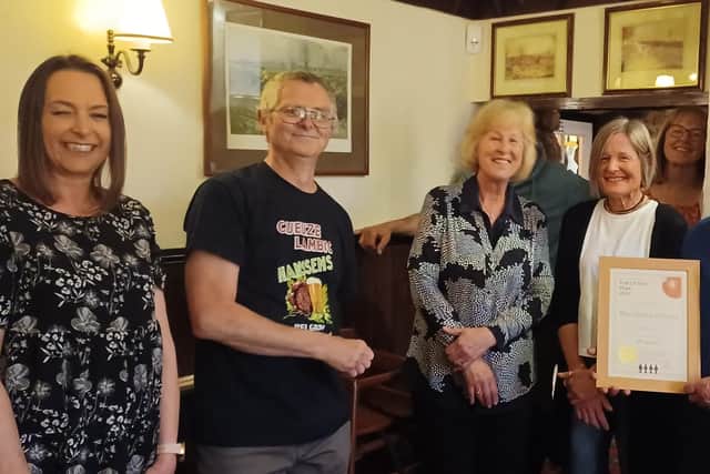 Jeff and Carol Evans are presented with Melton CAMRA's pub of the year certificate