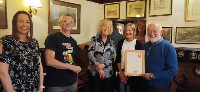 Jeff and Carol Evans are presented with Melton CAMRA's pub of the year certificate