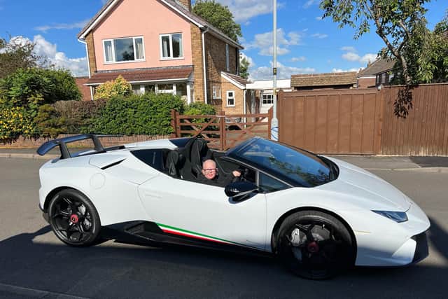 Rocco Worthington enjoys a ride in a Lamborghini thanks to a local resident