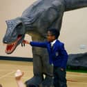 Reggie the animatronic T-Rex with a pupil at one of the Giant Journeys workshops.