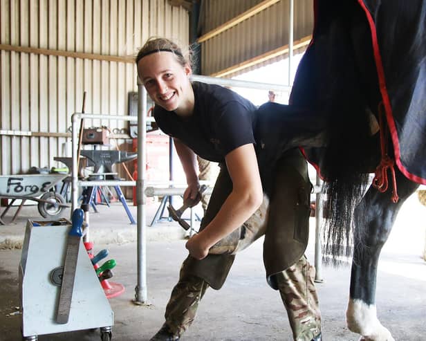 Abbie Robinson, of The King's Troop Royal Horse Artillery), working as a farrier