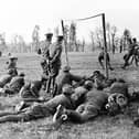 A photograph showing soldiers playing football while taking a break from fighting in the First World War IMAGE: www.leicestershirefootballarchive.com