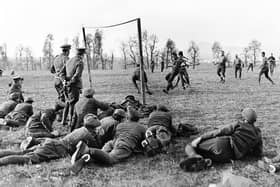 A photograph showing soldiers playing football while taking a break from fighting in the First World War IMAGE: www.leicestershirefootballarchive.com