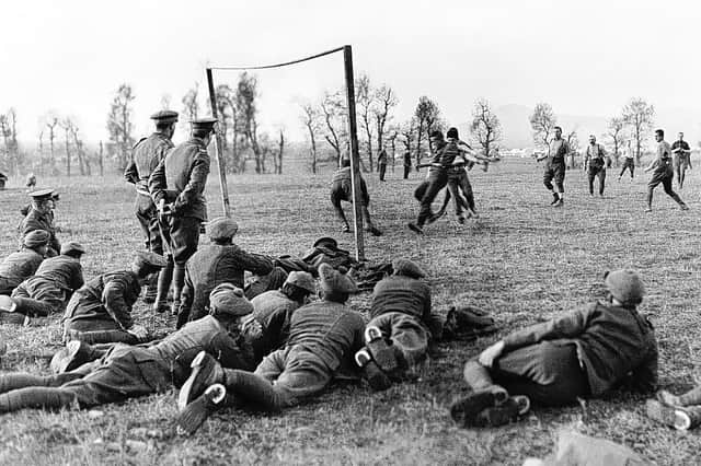A photograph showing soldiers playing football while taking a break from fighting in the First World War IMAGE: www.leicestershirefootballarchive.com