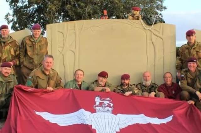 Serving and former paratroopers at the memorial to the 10th Battalion at Burrough on the Hill