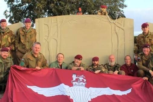 Serving and former paratroopers at the memorial to the 10th Battalion at Burrough on the Hill