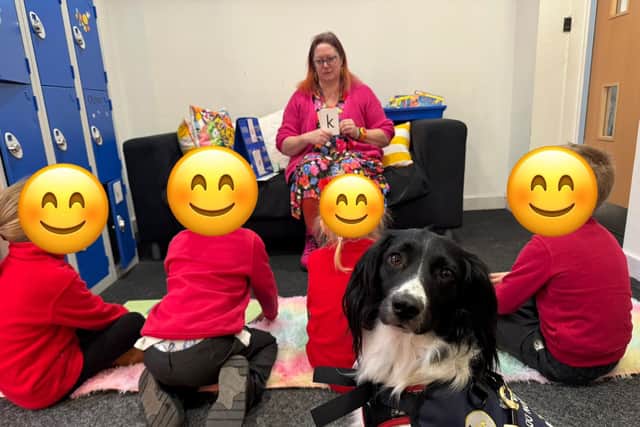 Poppy listening in a phonics group
