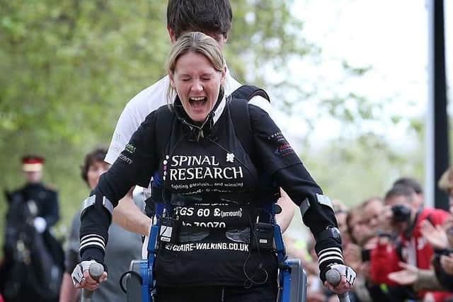 LONDON, ENGLAND - MAY 8, 2012:  Claire Lomas crosses the finishing line of the Virgin London Marathon. She took 16 days to complete the 26.2 mile route. Starting out with 36,000 other runners she has averaged 2 miles a day with the help of a bionic ReWalk suit.  (Photo by Peter Macdiarmid/Getty Images)