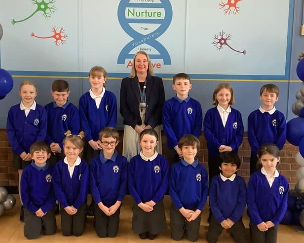 Headteacher Sonia Schofield with some of her pupils at Whissendine Primary School