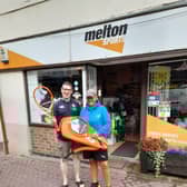 Head Coach Di Burdett receives her Head rackets and holdall from Melton Sports owner Michael Cook