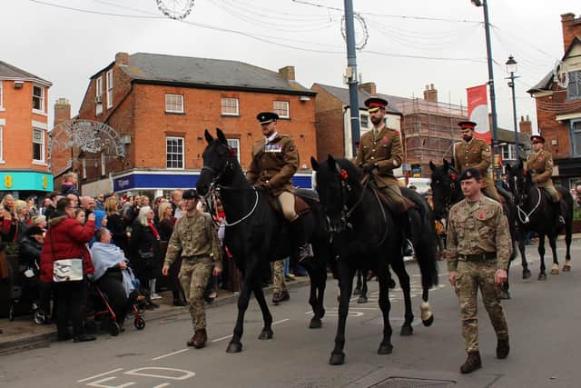 Mounted soldiers from the town's Defence Animal Training Regiment on parade