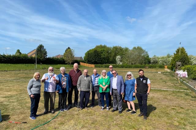 Representatives of Melton Indoor Bowls Club, Melton Learning Hub and Melton Mencap on the old bowls greens where a new woodland leisure facility is planned