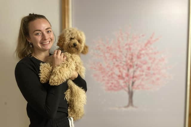 Melton funeral director, Jennifer Mousley, with her dog, Filbert, at her new premises in Mill Street