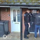The property on Mayfield Street is pictured being closed by police and council officials