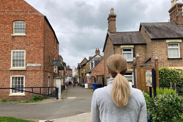 Nadiia looks down Church Street in Melton after escaping the Ukraine war (Nadiia asked us not to identify her in the photograph as she settles into life in the town)