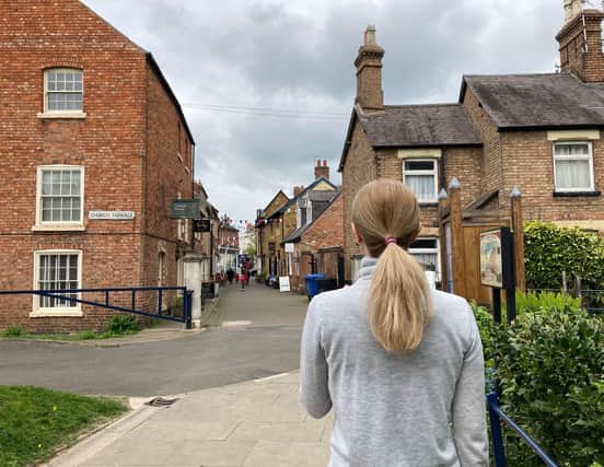 Nadiia looks down Church Street in Melton after escaping the Ukraine war (Nadiia asked us not to identify her in the photograph as she settles into life in the town)