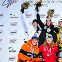 Amelia Coltman, centre, after the race in Germany.