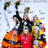 Amelia Coltman, centre, after the race in Germany.