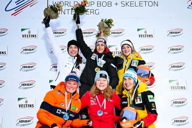 Amelia Coltman, centre, after the race in Germany.