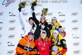 Amelia Coltman, centre, after the race in Germany.