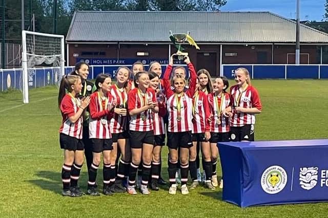 The under 13s celebrate.