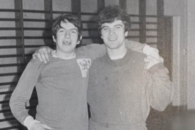 Jonny Garland and long time friend Brent Horobin take a break during a football training session for Melton Old Grammarians at the old school's small gym