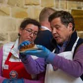 Judges assess one of the entries at the 2024 British Pie Awards at Melton Mowbray