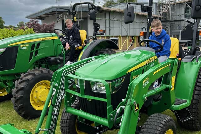 Youngsters check out the agricultural machinery at an open day at Brooksby college farm