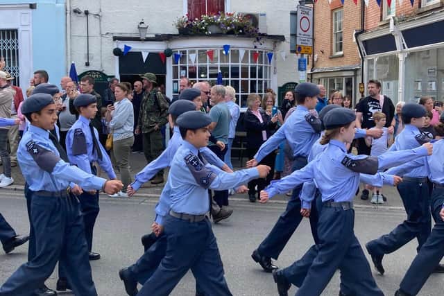 Air cadets march past The Grapes pub in Market Place during the Battle of Britain parade