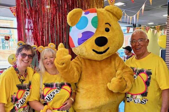 Some of the Bowlathon organisers, from left, Hazel Armstrong, Jane May and David Arrmstrong - with Pudsey at McDonald’s in Melton Mowbray PHOTO Paul Warrington