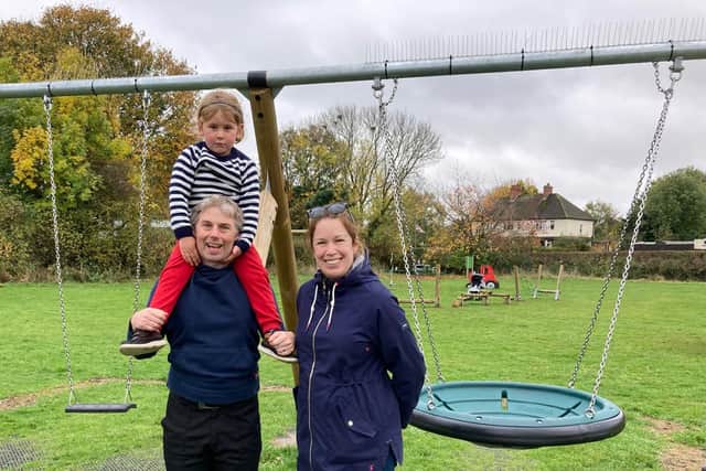 Claire Bennett-Madge, of Wymondham Sports and Social Partnership, and Dave Wickes-Pacey, with son Isaac (4), at the new playground at Wymondham