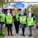 Swallowdale Primary School pupils show off their new hi vis kit bags