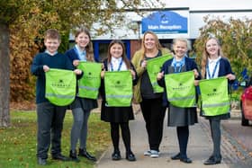 Swallowdale Primary School pupils show off their new hi vis kit bags