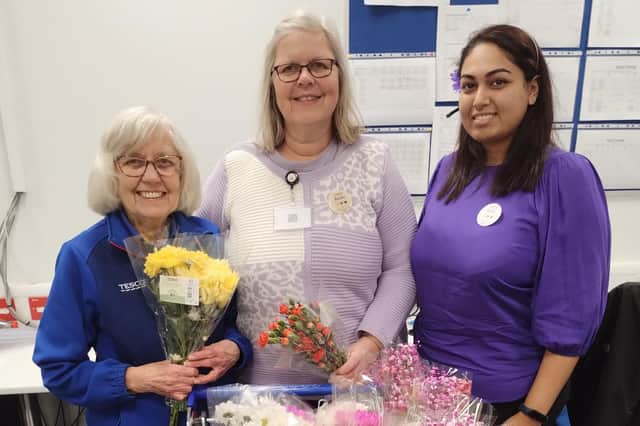 Staff at Melton supermarket, Tesco's. with their flowers on International Women's Day on Saturday