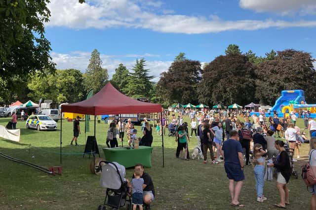 The scene in Play Close during Power in the Park with the stands and children's entertainment