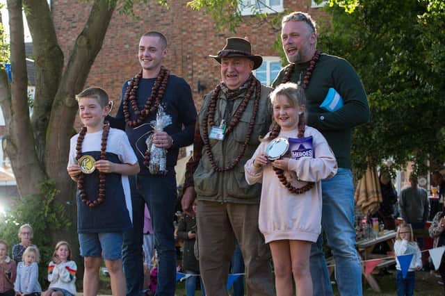 Winners and runners-up celebrate at The Vale Conker Championships at Long Clawson
PHOTO Chris Hardwick