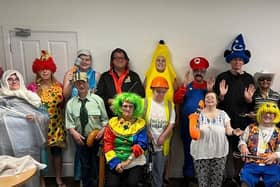 Members of Support and Connections wearing fancy dress for their fundraising week