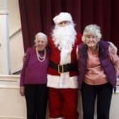 Santa drops in at a local Christmas party organised by the ReEngage charity